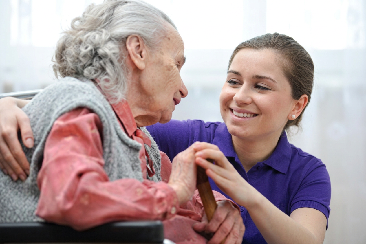 Caregiver supporting an elderly client